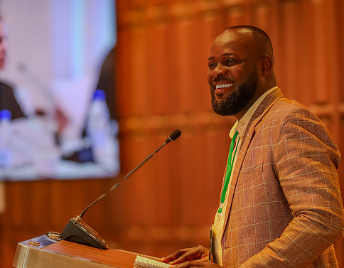 Presenter speaking during a conference session.